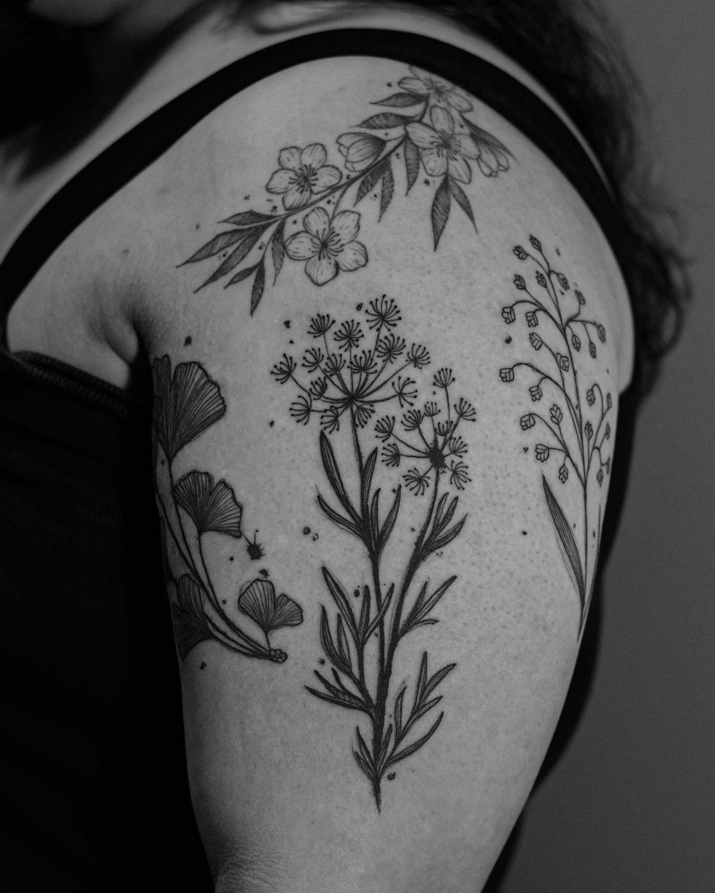 Floral tattoo made in fineline, sketch style, on the biceps area, inner part of the arm.