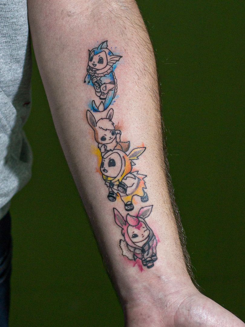 Minimalist tattoo made in fineline, colored, representing the pokemon "Eevee".